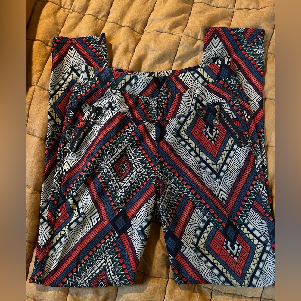 Funky red cropped pants with zipper pockets